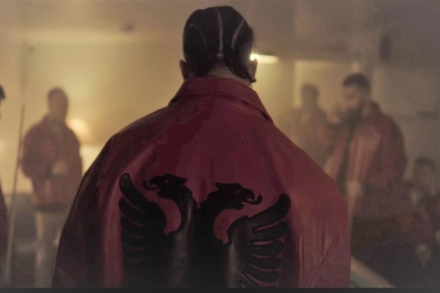 Drake wears in red and black in the music video of his new single Polar Opposites